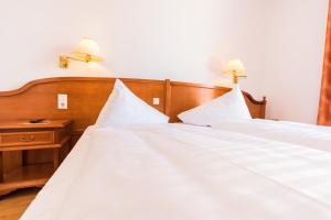 Postel nebo postele na pokoji v ubytování Familie Hopfeld - Hotel Dreikönigshof