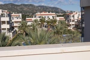 a view of a city with palm trees and buildings at Marineu Las Arenas in Alcossebre