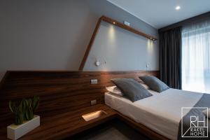 A bed or beds in a room at B&B Rakel Home