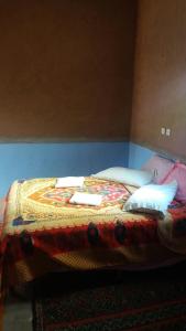 Postel nebo postele na pokoji v ubytování Camping Les Palmeraies