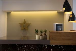 een ster op de muur van een lobby bij Golden Star Relax Hotel - Adults Only 16 plus in Tigaki