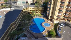 an overhead view of a swimming pool in a resort at Torres del Sol Playa de Las Vistas FREE WIFI in Playa de las Americas