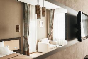 TV a/nebo společenská místnost v ubytování Ark Palace Hotel & SPA