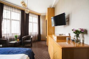 TV a/nebo společenská místnost v ubytování Ark Palace Hotel & SPA