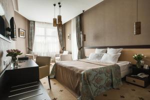 Postel nebo postele na pokoji v ubytování Ark Palace Hotel & SPA + 37 fotografií
