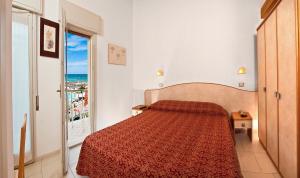 Voodi või voodid majutusasutuse Hotel Saint Tropez SPA & Restaurant toas