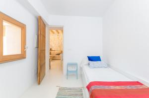Łóżko lub łóżka w pokoju w obiekcie Casa Vella (Vall Petit)