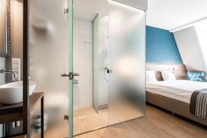 Postel nebo postele na pokoji v ubytování Melrose Hotel