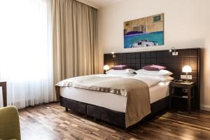 Posteľ alebo postele v izbe v ubytovaní Hotel Sandwirth