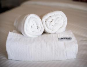 Postel nebo postele na pokoji v ubytování My Sj Hotel
