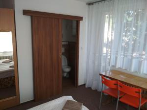 Posteľ alebo postele v izbe v ubytovaní Penzion Beta