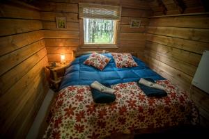 Säng eller sängar i ett rum på Laguna Condor - Refugio de Montaña