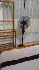 a fan sitting on top of a bed at Gem Villa in Weligama