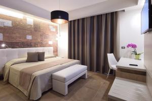 Postel nebo postele na pokoji v ubytování Hotel Pietra di Luna