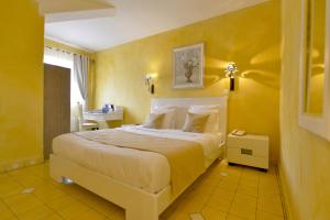 Postel nebo postele na pokoji v ubytování Hotel Le Cilaos