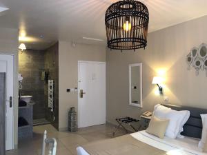 Postel nebo postele na pokoji v ubytování Hotel Le Cilaos