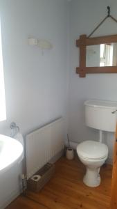 a bathroom with a toilet and a sink at Spindrift in Moville