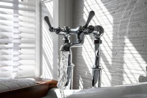 a water faucet with water coming out of it at Padstow Townhouse in Padstow