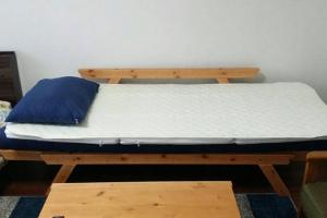 Posteľ alebo postele v izbe v ubytovaní Panda Stay Okayama