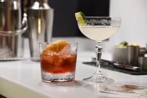 two cocktails sitting on a counter next to a glass at Padstow Townhouse in Padstow