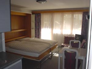 Postel nebo postele na pokoji v ubytování St Martin Apartments