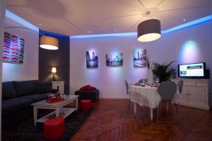 a living room with a table and a couch at The Appart in Lille