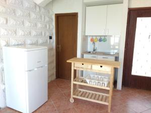 Kuchyň nebo kuchyňský kout v ubytování Apartments Bassi + 37 fotografií