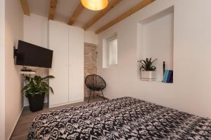Postel nebo postele na pokoji v ubytování Apartments Stube 4