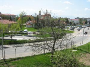 a view of a street with cars parked on the road at Khan Krum House & Apartments for rent in Elin Pelin