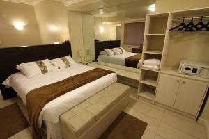 
Cama ou camas em um quarto em Hotel Curi Executive

