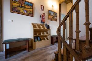 a stairway with a bench and a stair case at La Casona de Sarria in Sarria