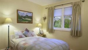 a bedroom with a bed and a window at Rustridge Ranch & Winery in St. Helena