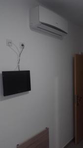 a tv hanging on a wall in a room at Hospederia Gomis 26 in Ontinyent +25 photos