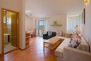 a living room with a couch and a table at Apartment Ivanovic Family in Becici