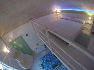 A bed or beds in a room at Casa di Ninni Mono