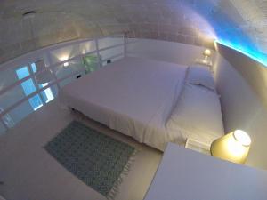 A bed or beds in a room at Casa di Ninni Mono