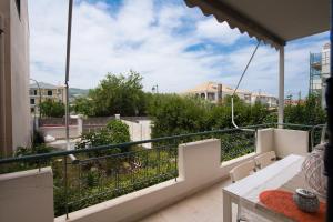 a balcony with a view of a city at La casa di Iro in Lefkada