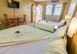 Postel nebo postele na pokoji v ubytování Hotel Le Priss + 37 fotografií