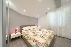 A bed or beds in a room at Apartments VALL