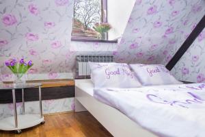 Postel nebo postele na pokoji v ubytování Hostel Centar
