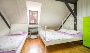 Postel nebo postele na pokoji v ubytování Hostel Centar