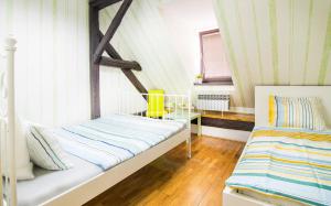 Postel nebo postele na pokoji v ubytování Hostel Centar