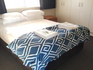 Voodi või voodid majutusasutuse Excellsior Apartments toas