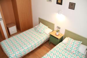 A bed or beds in a room at Teatro Cervantes SigloXXI