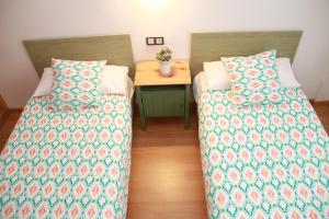 A bed or beds in a room at Teatro Cervantes SigloXXI