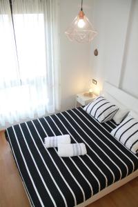A bed or beds in a room at Teatro Cervantes SigloXXI