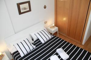 A bed or beds in a room at Teatro Cervantes SigloXXI