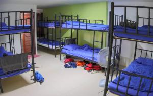 Letto o letti in una camera di P & T Hostel