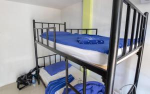 Letto o letti in una camera di P & T Hostel