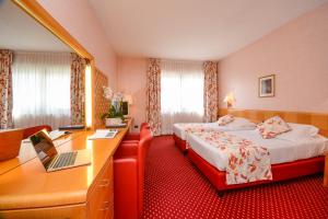 Posteľ alebo postele v izbe v ubytovaní Hotel Oliveto